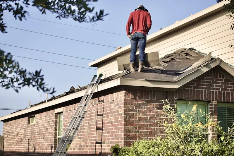 Professional roofer working on a residential roof in Mayfield Ranch